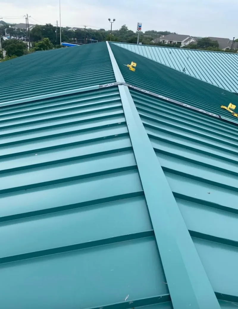 Green commercial metal roof ridge and valley for Metal Roof Repair in Beeville